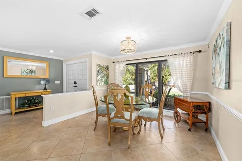 a dining room with furniture and a window