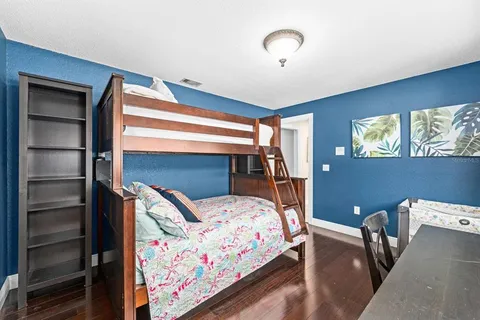 a bedroom with furniture and a chandelier