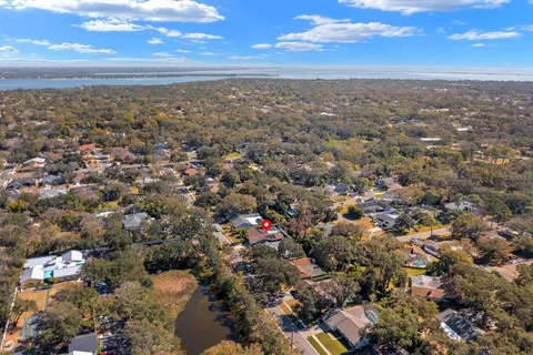 an aerial view of residential building and green space