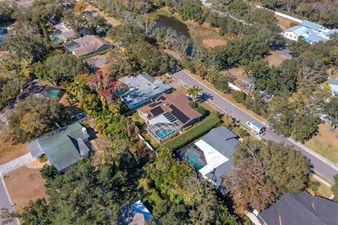 an aerial view of a house with a yard