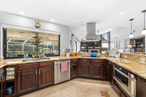 a kitchen with lots of counter top space sink and stove