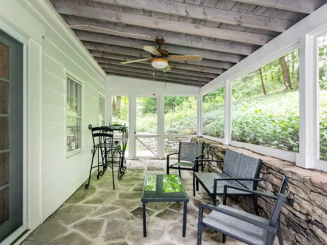 a view of an outdoor space with furniture