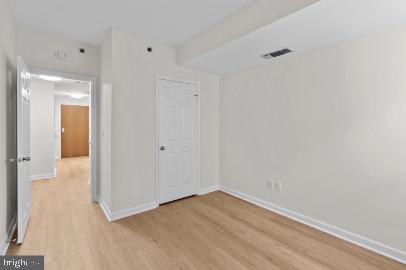 960 Fell Street, Unit 402 Baltimore, MD 21231 - Photo 15 of 18 a view of a room with wooden floor