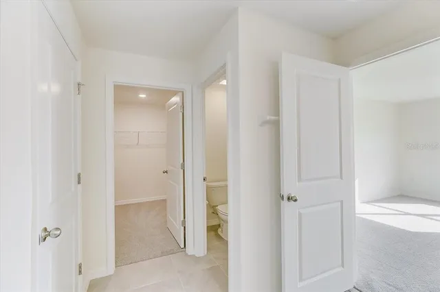 a view of a hallway with closet area