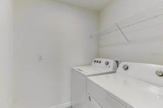 a utility room with dryer and washer
