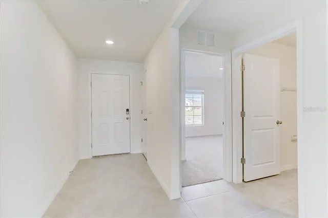an empty room with closet area