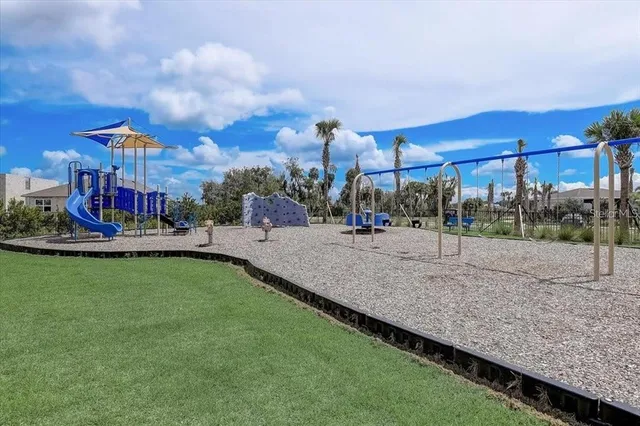 a view of a park with large trees