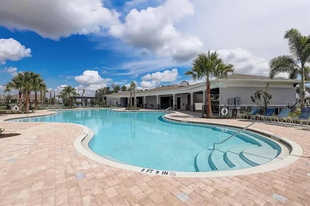 a view of a swimming pool with a patio