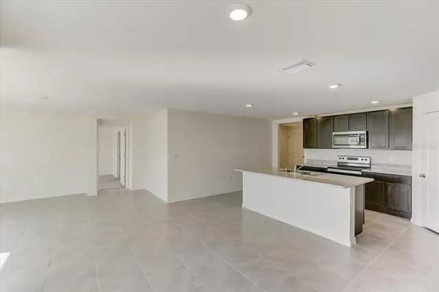 a kitchen with stainless steel appliances granite countertop a stove and a refrigerator