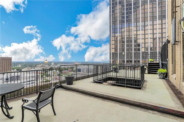a view of balcony with a potted plant
