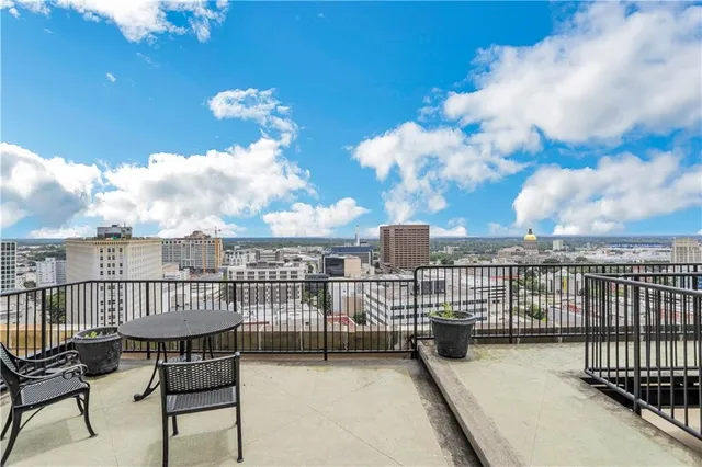 a view of a balcony with a potted plant