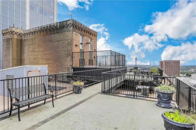 a view of a balcony with chairs
