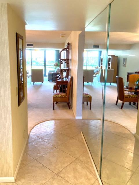 501 South Seas Drive, Unit 406 Jupiter, FL 33477 - Photo 7 of 15 Mirrored entrance foyer
