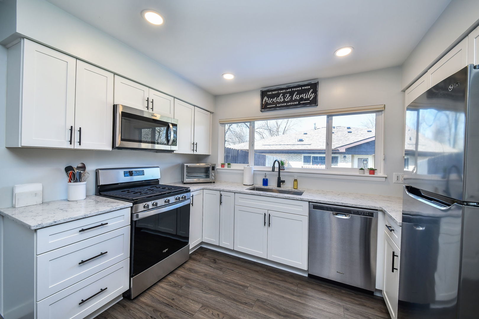 327 South Jackson Street Batavia, IL 60510 - Photo 7 of 14 a kitchen with stainless steel appliances granite countertop a stove sink and cabinets