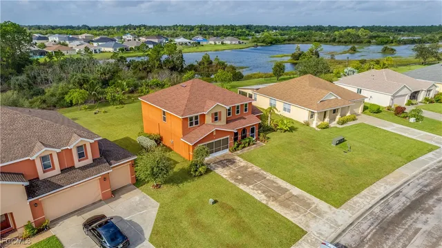 an aerial view of a house with a lake view