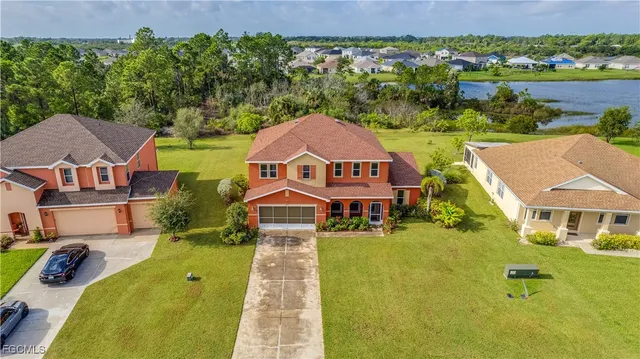 an aerial view of a house with a swimming pool
