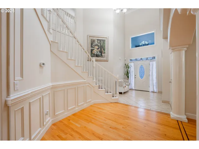 a view of an entryway with wooden floor
