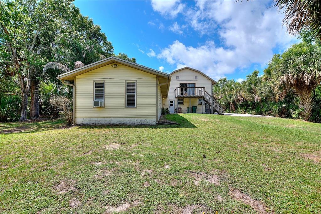 3641 Turtle Mound Road Melbourne, FL 32934 - Photo 63 of 77 a view of a house with a yard