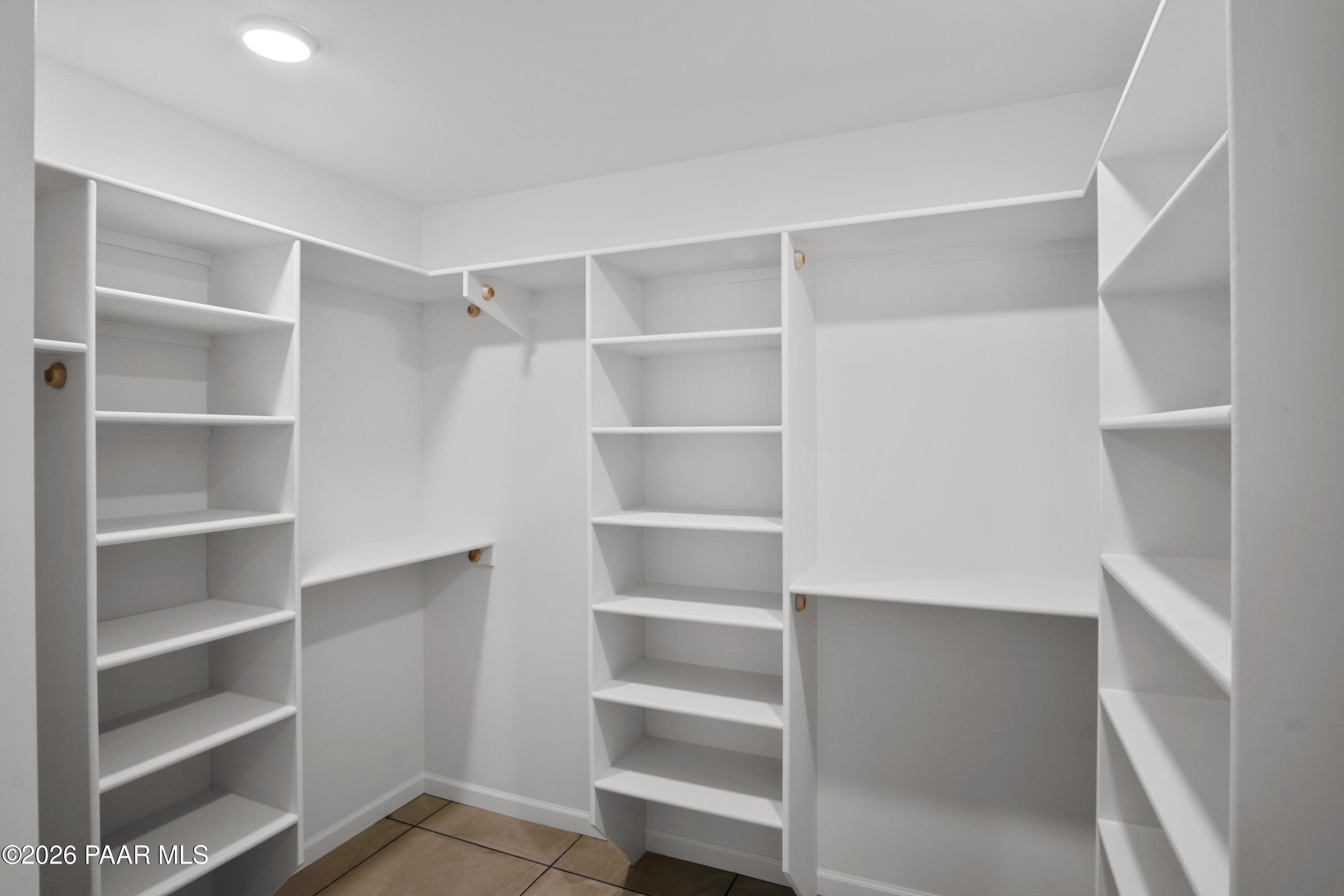 4920 East Amber Road Prescott, AZ 86301 - Photo 26 of 38 a view of walk in closet with empty racks