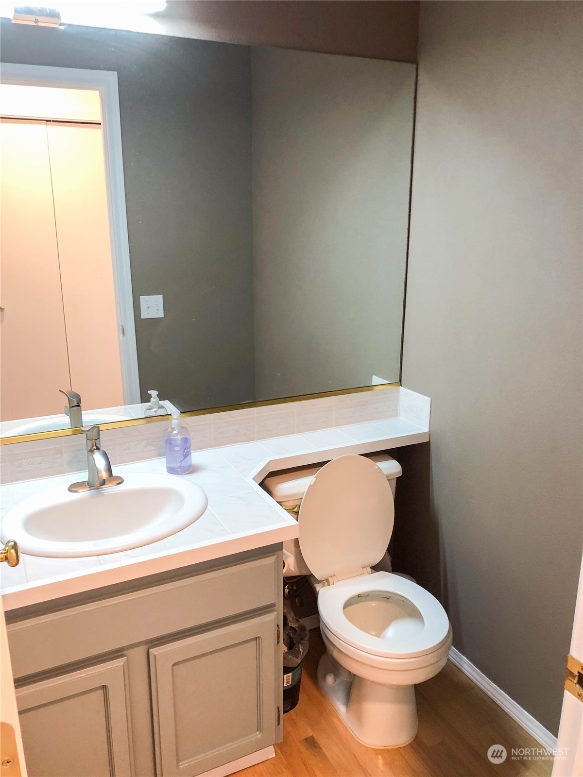 4302 Northeast 6th Place Renton, WA 98059 - Photo 12 of 20 a bathroom with a toilet sink and mirror