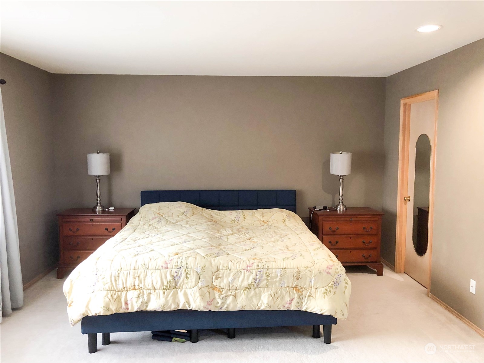 4302 Northeast 6th Place Renton, WA 98059 - Photo 13 of 20 a bedroom with a bed and a lamp