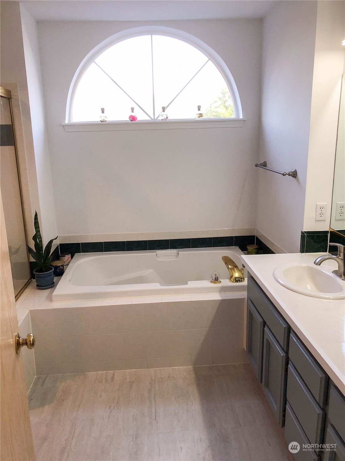 4302 Northeast 6th Place Renton, WA 98059 - Photo 14 of 20 a bathroom with a tub sink and mirror