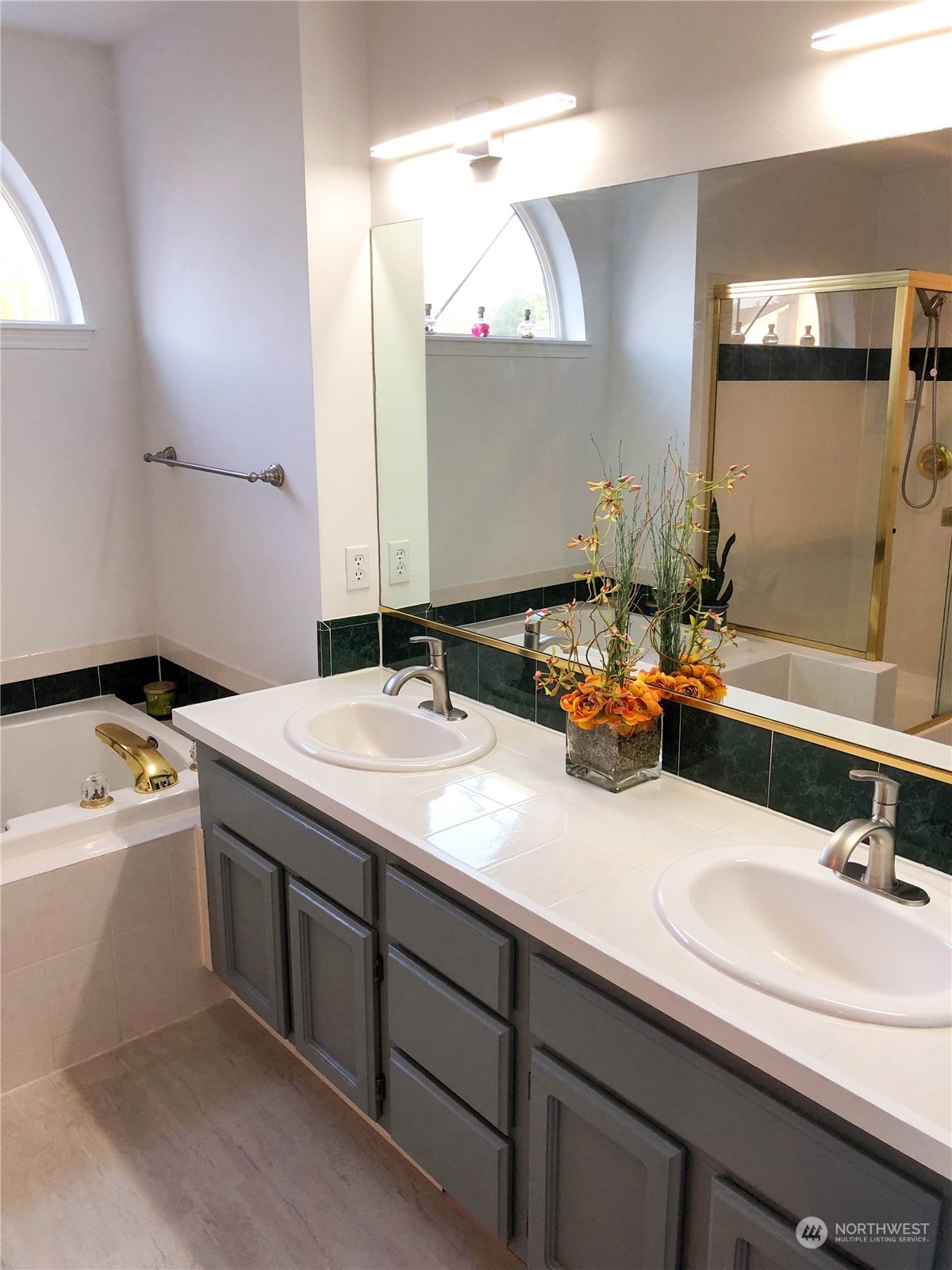 4302 Northeast 6th Place Renton, WA 98059 - Photo 15 of 20 a bathroom with a sink and a mirror