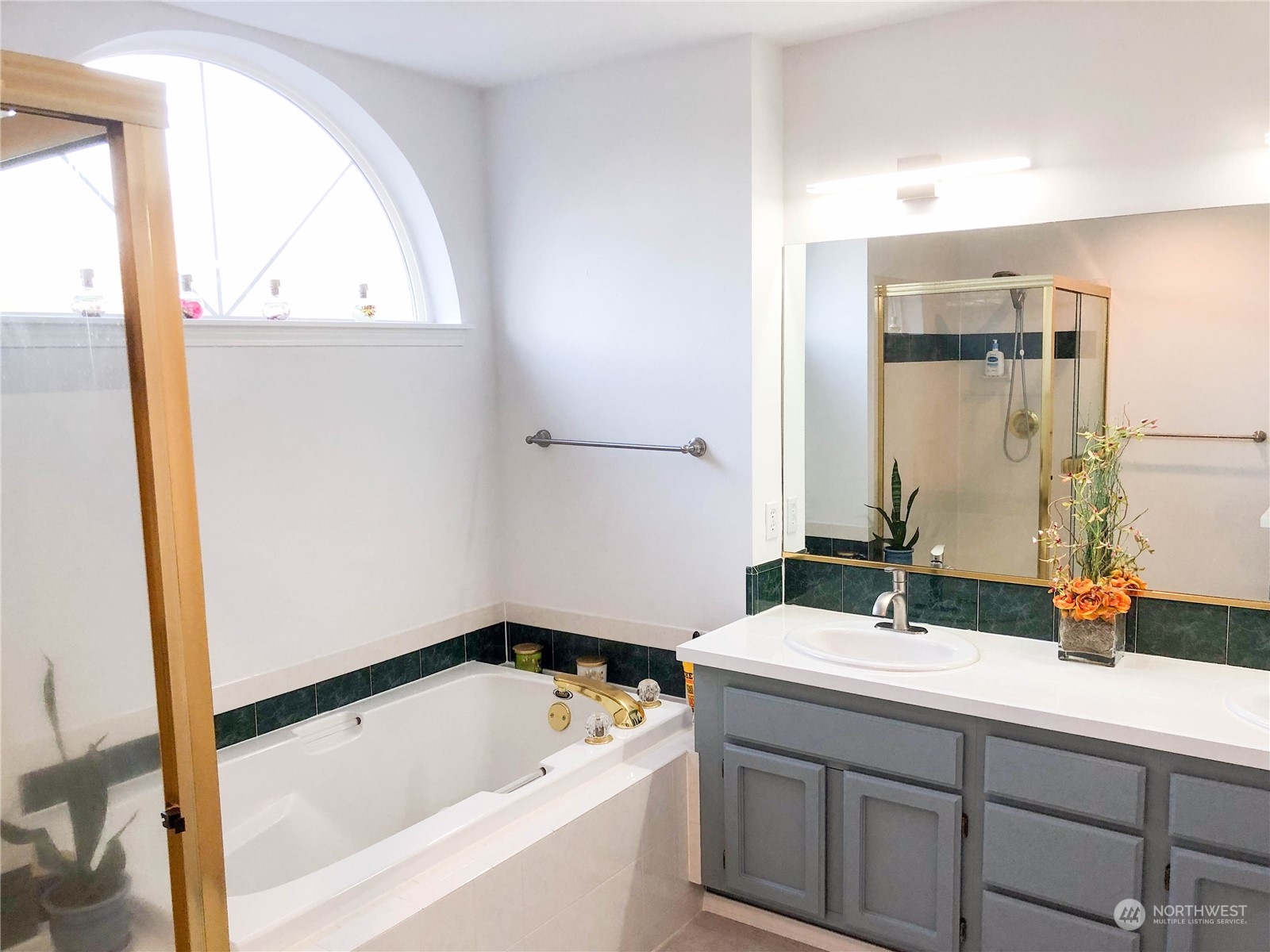 4302 Northeast 6th Place Renton, WA 98059 - Photo 17 of 20 a bathroom with a sink and a bathtub