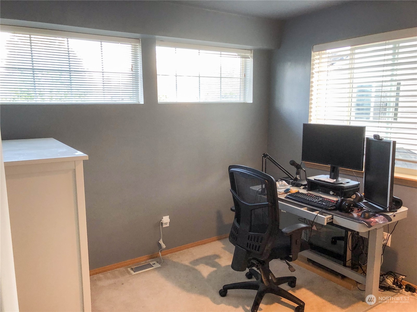 4302 Northeast 6th Place Renton, WA 98059 - Photo 18 of 20 a view of a workspace with furniture and a window