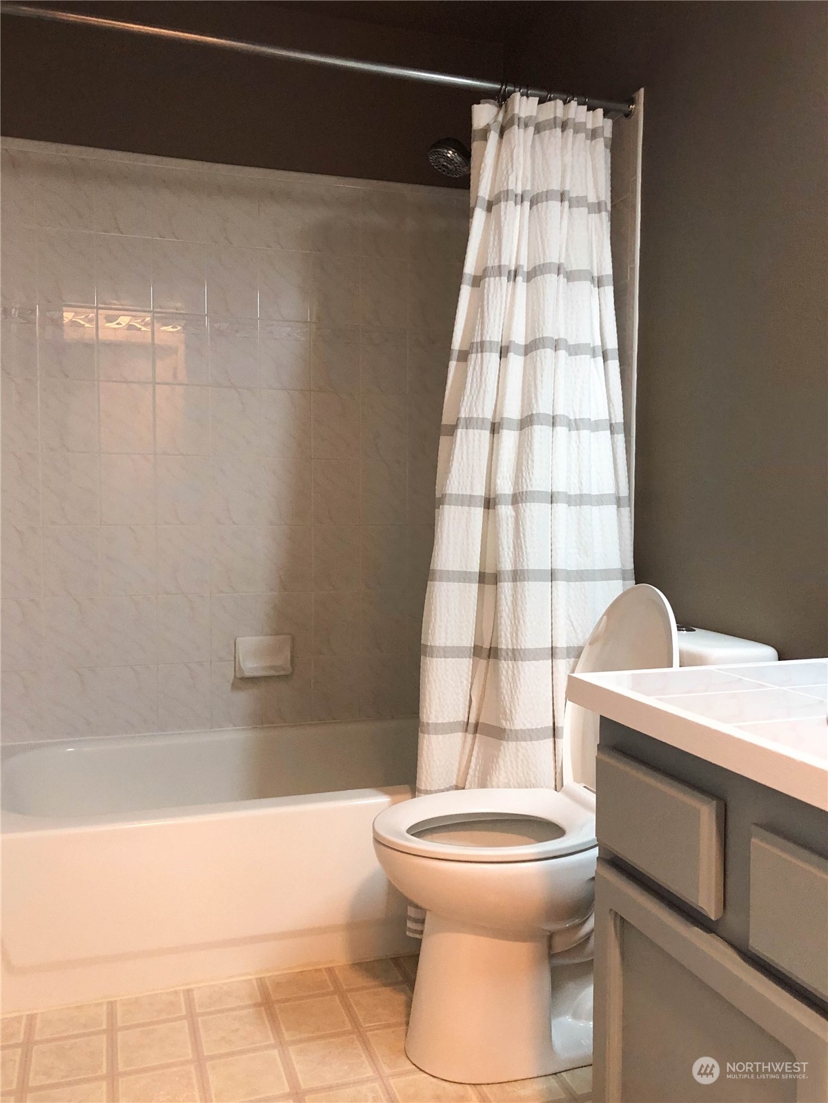 4302 Northeast 6th Place Renton, WA 98059 - Photo 20 of 20 a bathroom with a toilet a sink and bathtub