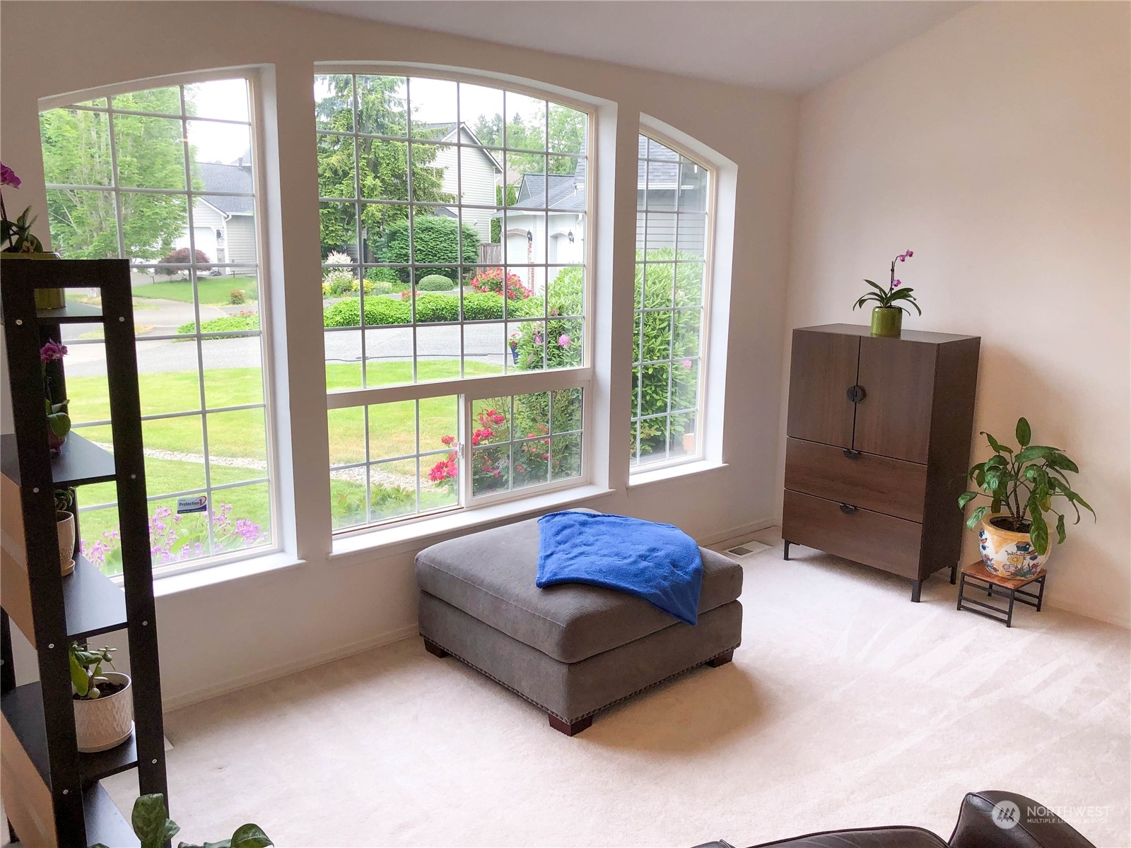 4302 Northeast 6th Place Renton, WA 98059 - Photo 6 of 20 a living room with furniture and large windows