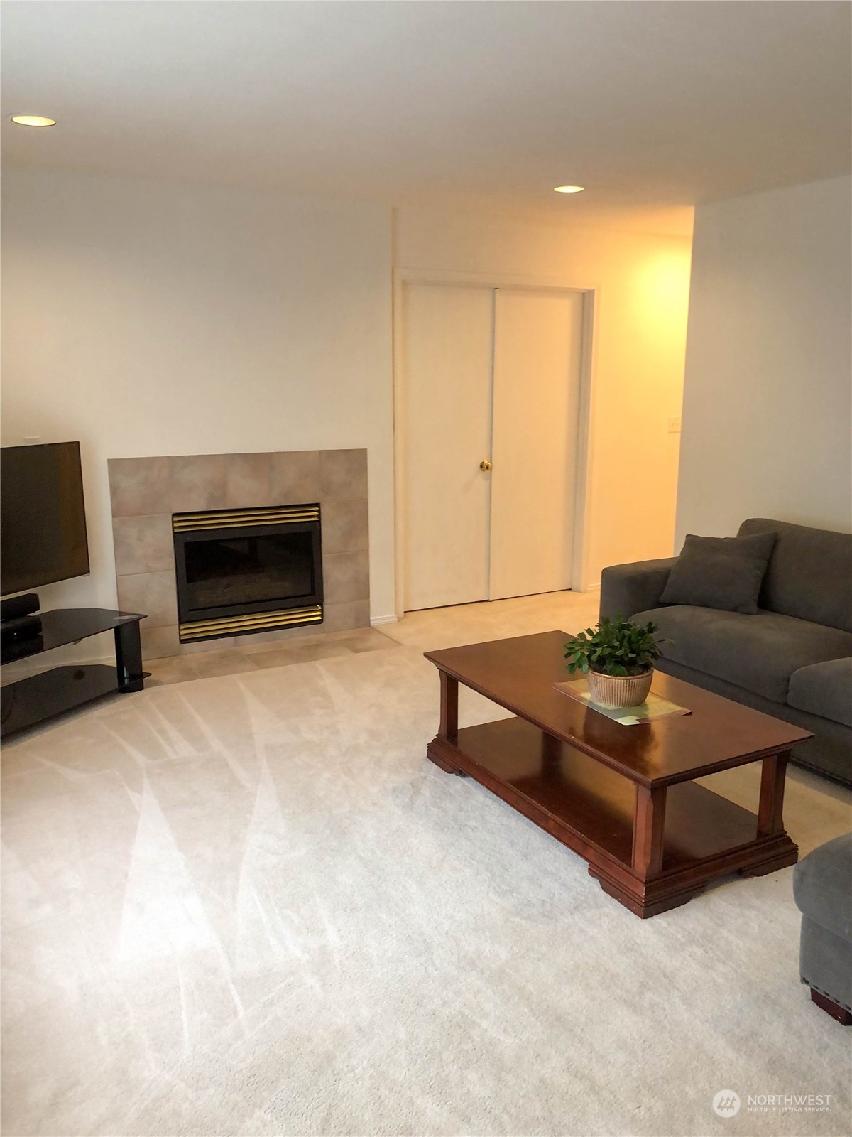 4302 Northeast 6th Place Renton, WA 98059 - Photo 10 of 20 a living room with furniture and a fireplace