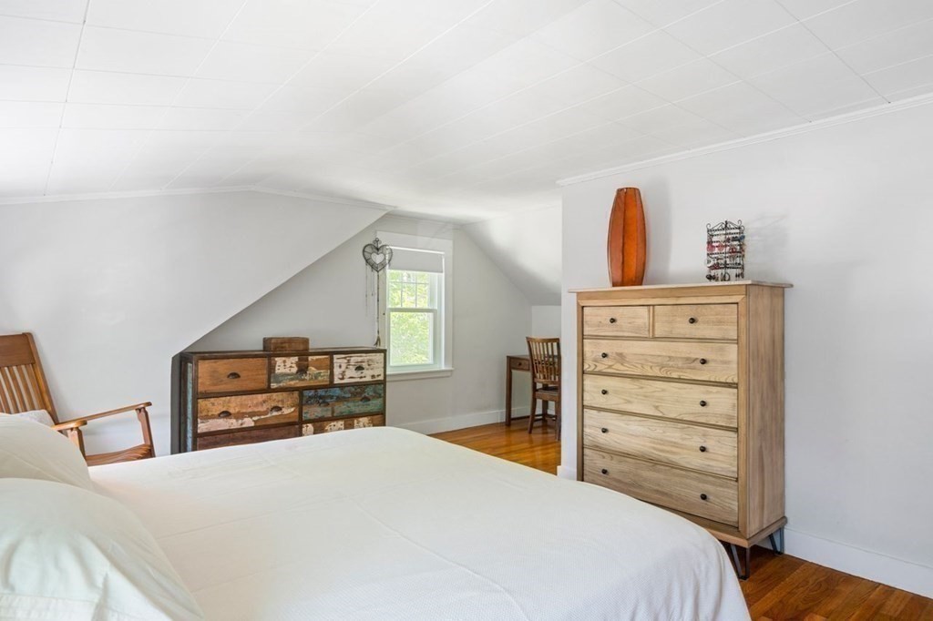 11 Sunset Road Arlington, MA 02474 - Photo 13 of 27 a bedroom with a bed and dresser