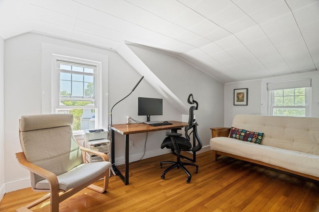 11 Sunset Road Arlington, MA 02474 - Photo 15 of 27 a workspace with furniture and a wooden floor
