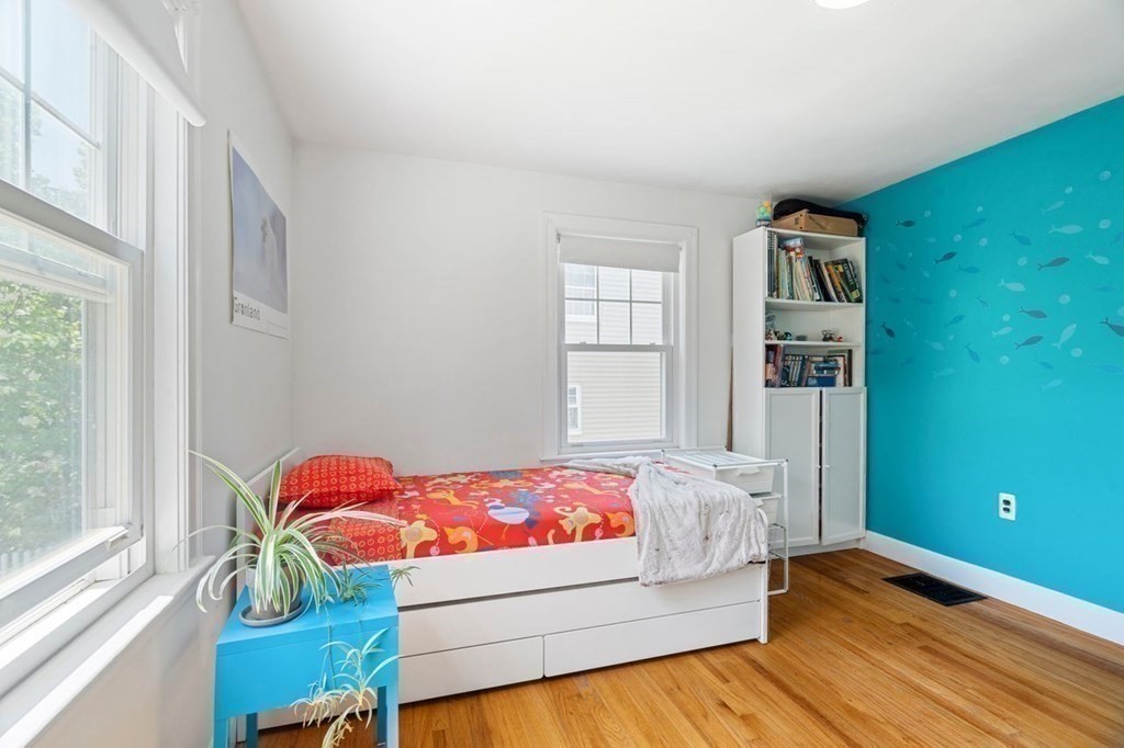 11 Sunset Road Arlington, MA 02474 - Photo 19 of 27 a bedroom with a bed and windows