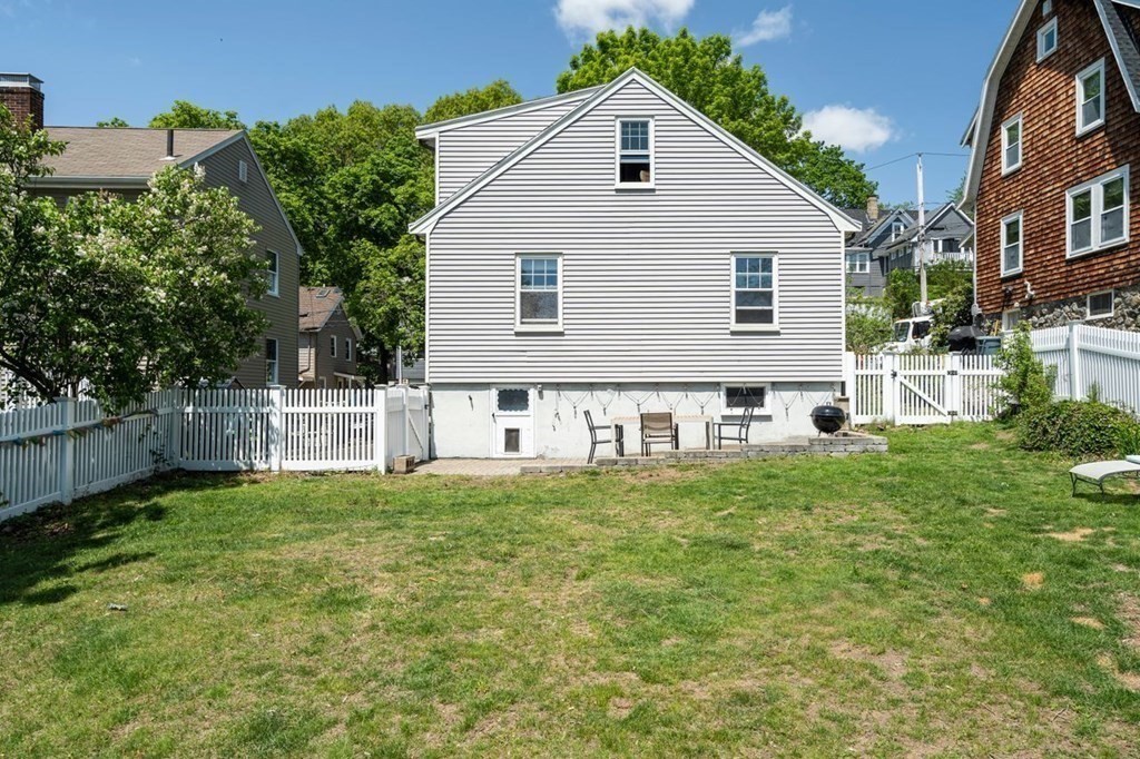 11 Sunset Road Arlington, MA 02474 - Photo 23 of 27 a view of a house with backyard and a tree