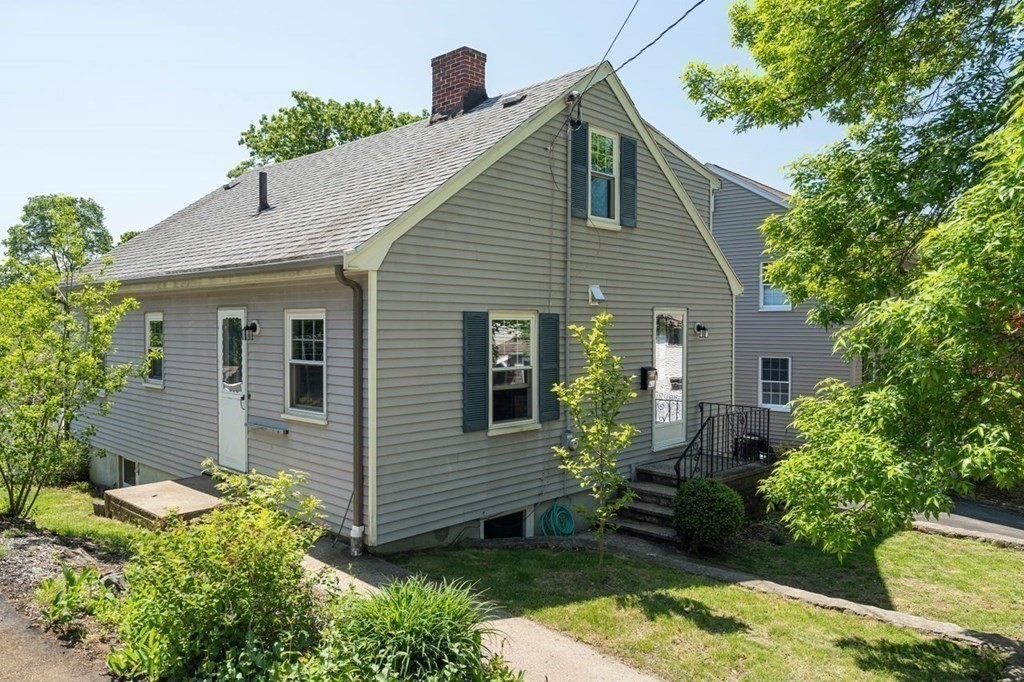 11 Sunset Road Arlington, MA 02474 - Photo 26 of 27 a front view of a house with a yard