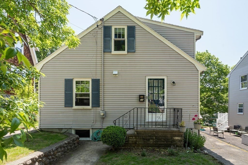 11 Sunset Road Arlington, MA 02474 - Photo 27 of 27 a view of a house with a yard and potted plants