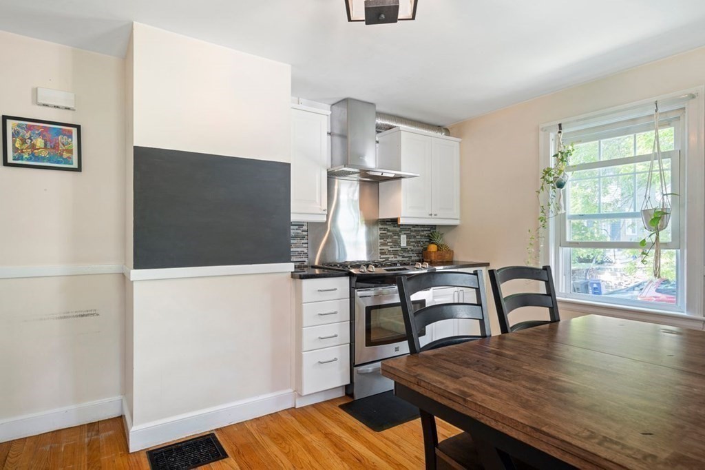 11 Sunset Road Arlington, MA 02474 - Photo 6 of 27 a workspace with furniture and wooden floor