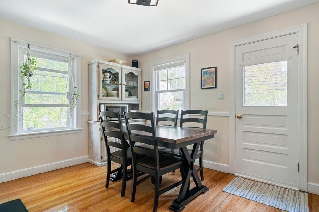 11 Sunset Road Arlington, MA 02474 - Photo 7 of 27 a view of a dining room with furniture and wooden floor