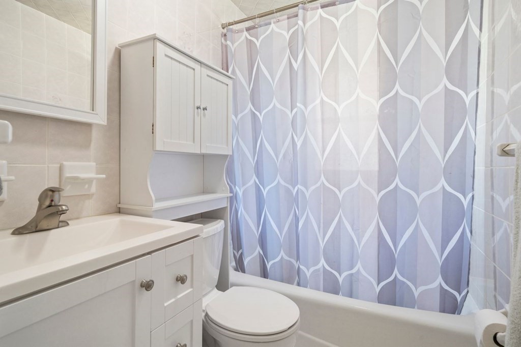 11 Sunset Road Arlington, MA 02474 - Photo 9 of 27 a bathroom with a sink toilet and shower