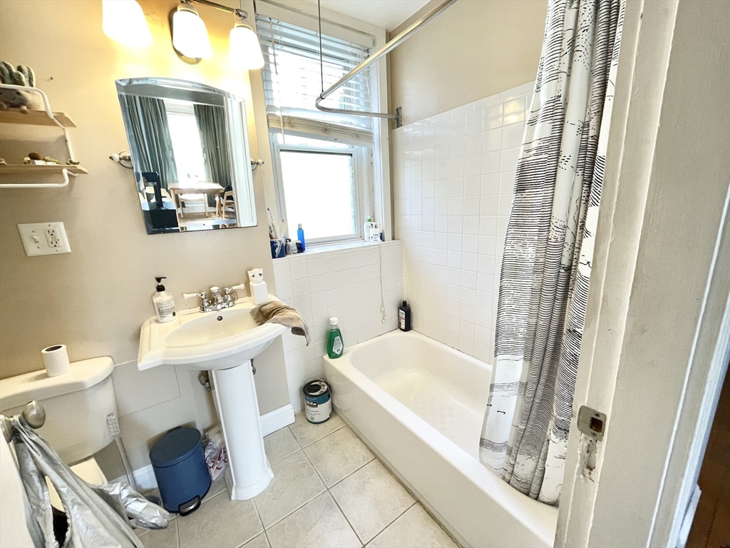 131 Park Drive, Unit 25 Boston, MA 02215 - Photo 5 of 13 a bathroom with a sink toilet and shower