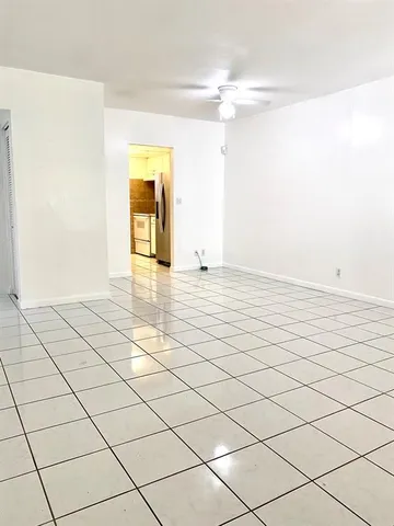 a view of an empty room and window