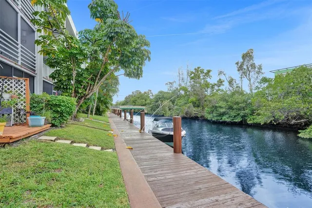 a view of a lake with a house in the background