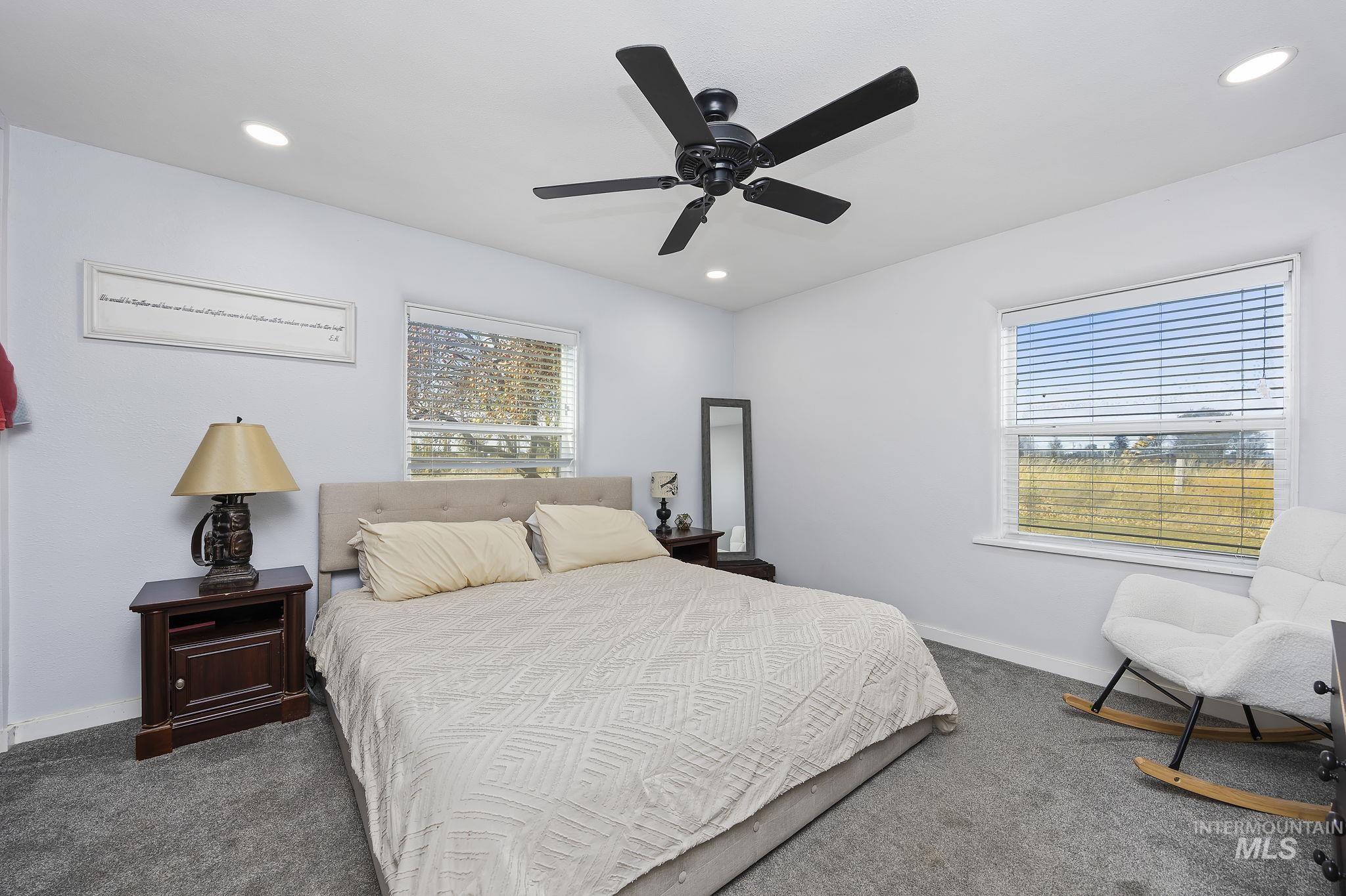 128 South 100 East Rupert, ID 83350 - Photo 16 of 44 Bedroom featuring dark colored carpet, recessed lighting, and ceiling fan
