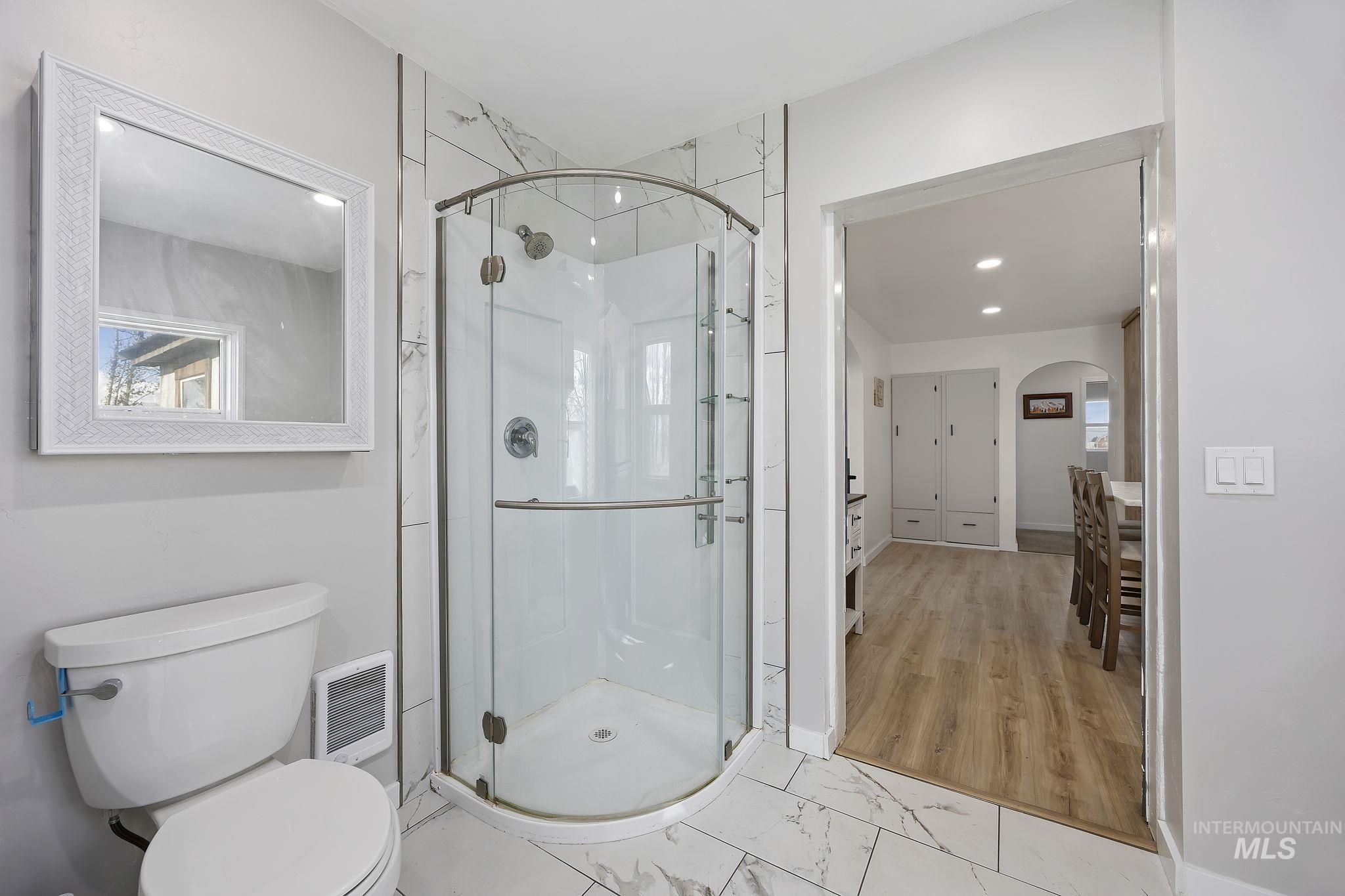 128 South 100 East Rupert, ID 83350 - Photo 18 of 44 Full bath with light marble finish flooring, a shower stall, and recessed lighting