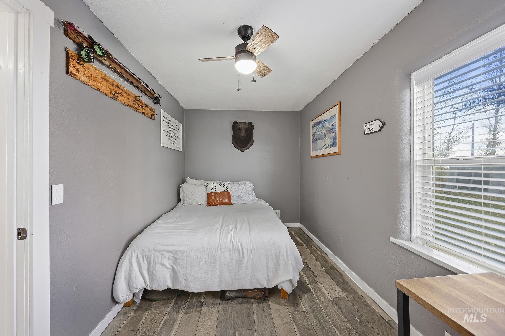 128 South 100 East Rupert, ID 83350 - Photo 24 of 44 Bedroom featuring dark wood finished floors and a ceiling fan