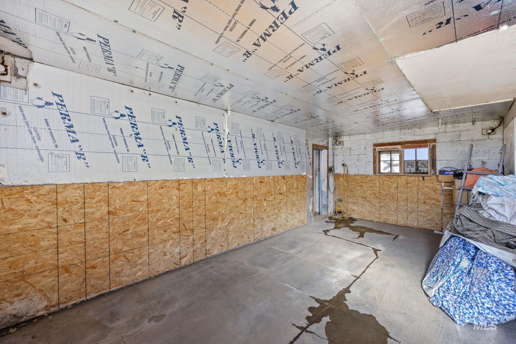 128 South 100 East Rupert, ID 83350 - Photo 33 of 44 Miscellaneous room featuring concrete floors and concrete block wall