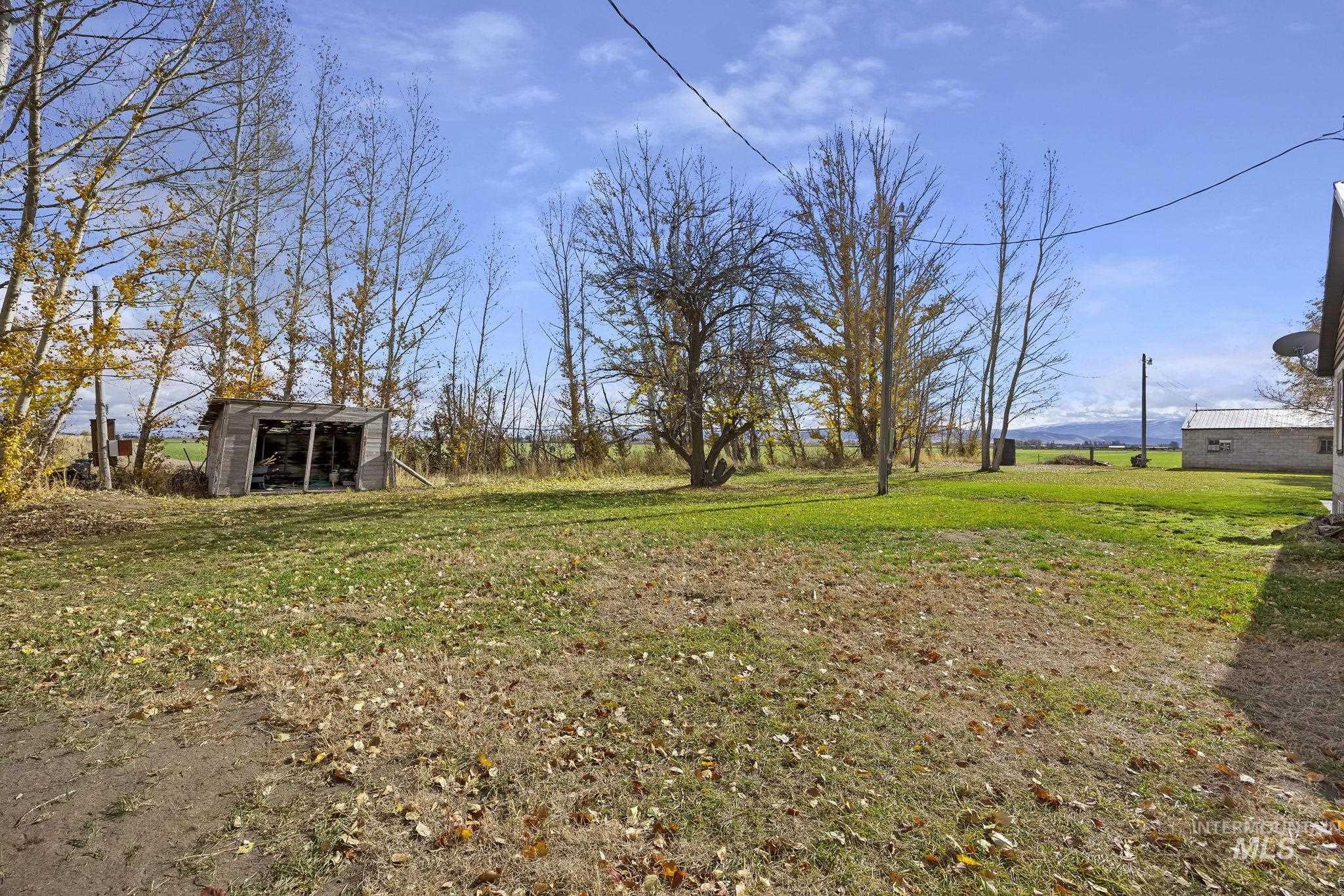 128 South 100 East Rupert, ID 83350 - Photo 38 of 44 View of grassy yard with an outdoor structure