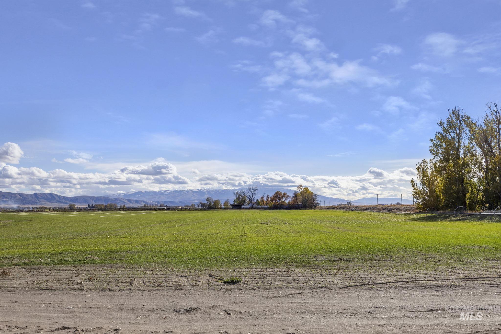 128 South 100 East Rupert, ID 83350 - Photo 39 of 44 View of nature featuring a mountain backdrop and rural landscape